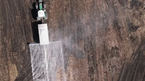 Top View Of A Farm Tractor Adding Lime To The Natural Soil Stock Footage 276651702