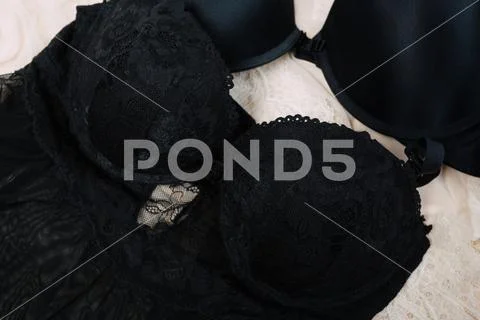 Top view of fashionable women's different brassiere on beige background with Stock Photos