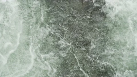 Top view of fast flowing water in a clear river in Norway Stock Footage 237997086
