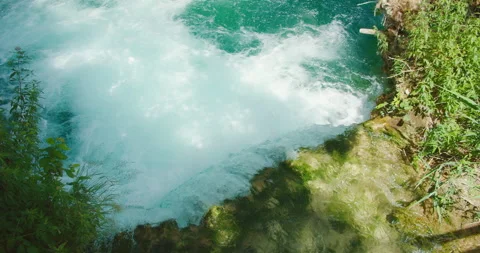 Top view of fast-flowing waterfall with foamy water in Plitvice Lakes summer day Stock Footage 310423639