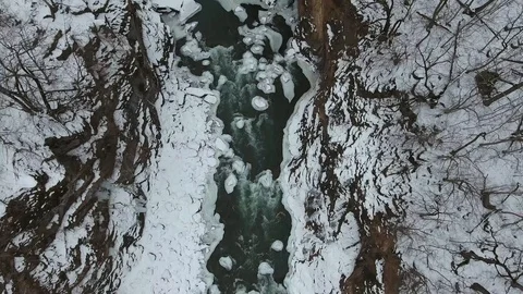 Top view of fast mountain river in snowy forest Stock Footage 114065206