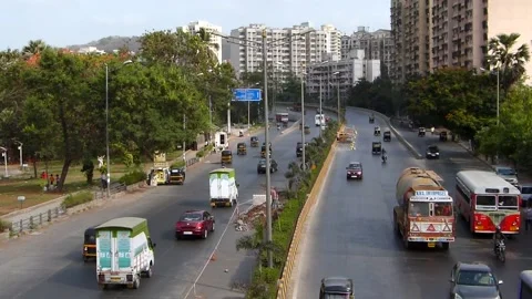 Top View of fast moving road traffic, Powai Lake Mumbai city Maharashtra India Stock Footage 232575132