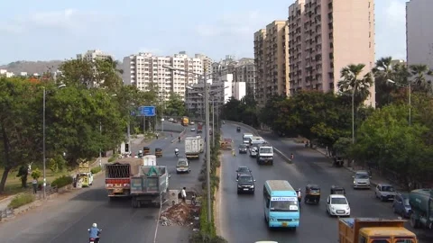 Top View of fast moving road traffic, Powai Lake Mumbai city Maharashtra India Stock Footage 232577198
