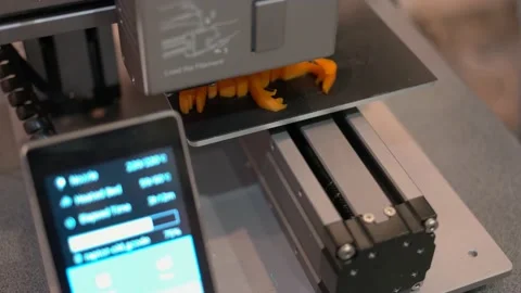 Top view fast speed motion 3d printer is making a yellow figure. Stock Footage 166112795
