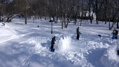 Top view father wit son building snow fortress Stock Footage 164724301