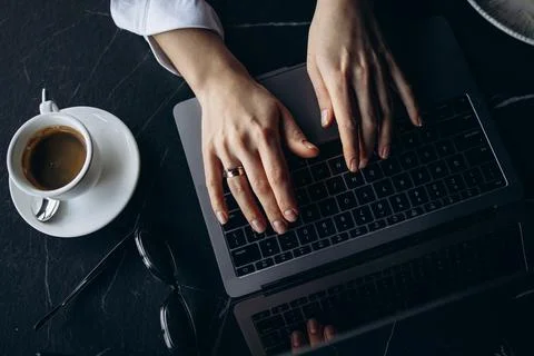 Top view feamle hands typing on computer Stock Photos