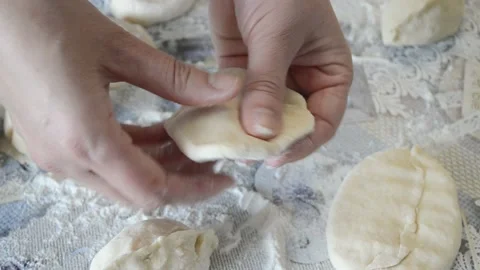 Top view female arms making patties, women works with dough at home, Ukrainian Stock Footage 174722108