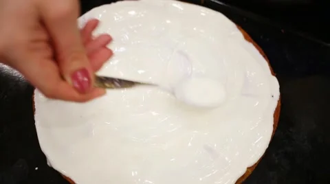 Top view of female hand making cake with sweet white cream Video stock 63028198