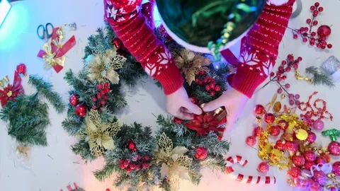 Top view of female hands assembling Xmas wreath Video stock 287279045