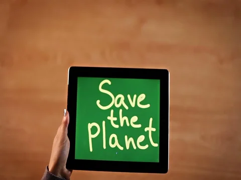 Top view female hands erasing Save the planet bold Stock Footage 72412158
