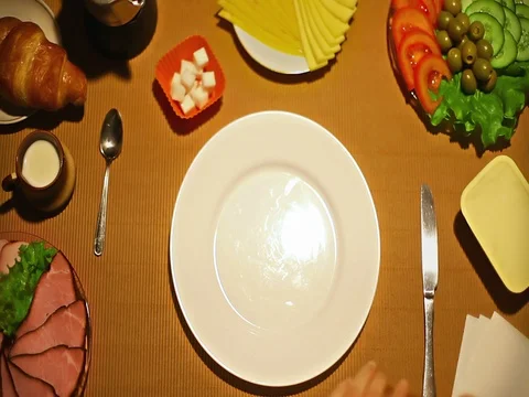 Top view female hands making closed sandwich for breakfast Stock Footage 73256121