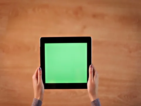 Top view female hands scrolling images on digital tablet horizontal position Stock Footage 72411928