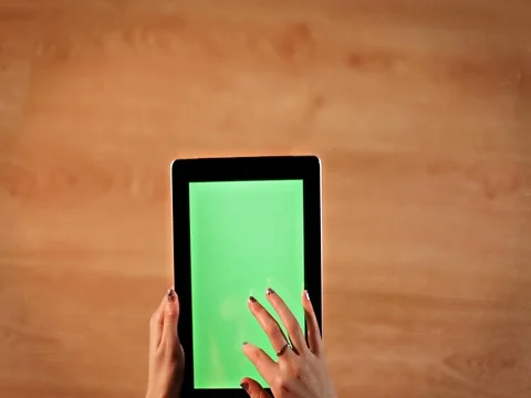 Top view female hands scrollings on digital tablet vertical position Stock Footage 72411886