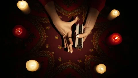 Top view, female hands shuffling tarot cards and picking one card from the deck Stock Footage 247978918