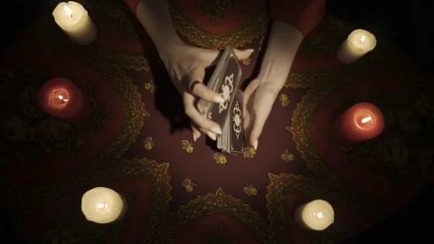Top view, female hands shuffling tarot cards and putting it on the table. HDR Stock Footage 248003076