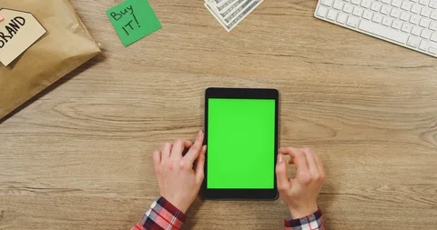 Top view on the female hands taping on the black vertical tablet device with a Stock Footage 89952038