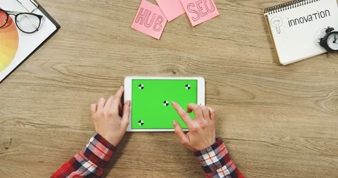 Top view on the female hands taping on the white horizontal tablet computer with Stock Footage 89963553