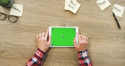 Top view of the female hands taping on the white horizontal tablet computer with Stock Footage 89973710