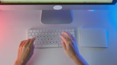 Top view of female hands working on desktop computer with keyboard and mouse Stock Footage 333765040