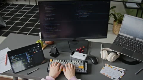 Top view of Female Programmer Writing Code with Help from AI Agent Stock Footage 335940164