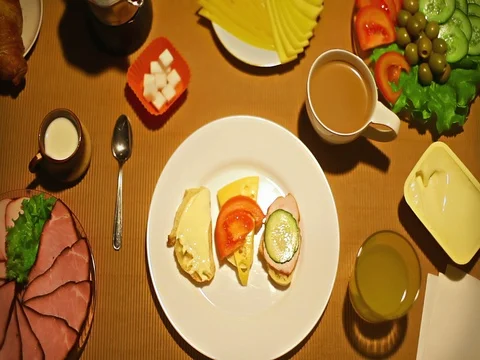 Top view female taking a bite of small open faced sandiwch for breakfast Stock-Footage 73257046