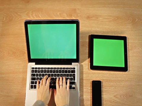 Top view female using laptop in workspace with gadgets Stock Footage 72411289