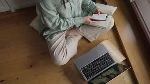 Top view female working studying online using laptop sitting on floor at home Stock Footage 254738071