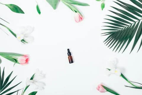 Top view feminine composition with tiny cosmetic vial Fotos Stock