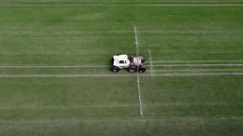 Top view. Fertilizing winter crops with a tractor. Agriculture concept. Stock Footage 239684716