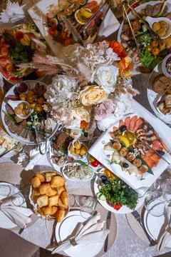 Top view of the festive table with various dishes and snacks Stock Photos
