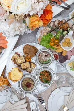 Top view of the festive table with various dishes and snacks Stock Photos