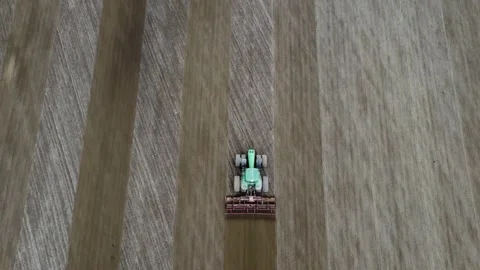 Top view of the field and tractor. Soil cultivation for planting a new crop. Stock Footage 239103716