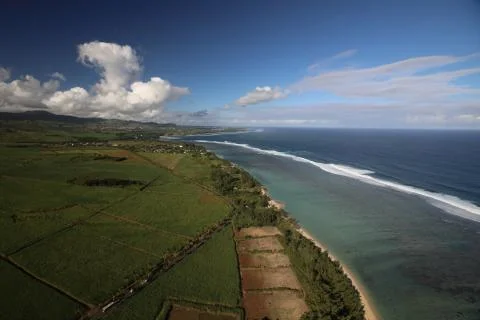 Top view of a fields beach and sea with waves. Stock Photos