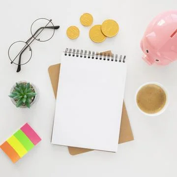 Top view financial elements arrangement with empty notepad 写真素材