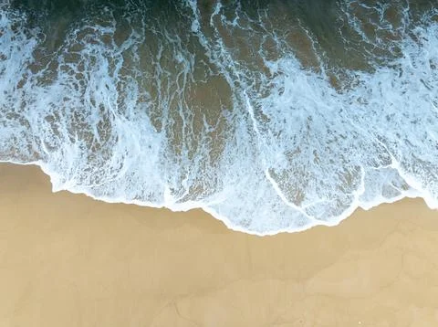 Top view of Fine sand texture natural background Waves crashing on sand Sum.. Stock Photos