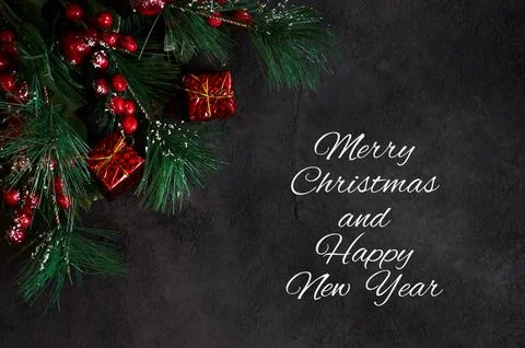 Top view on fir tree branches and gift boxes on dark background. Banner wit.. 写真素材