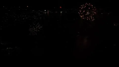 Top view of fireworks lighting up the night sky during a festive New Year Stock Footage 325949203