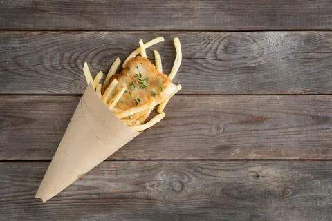 Top view fish and chips wrapped in cone Fish and chips. Overhead view frie... Stock Photos