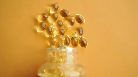 Top view of  fish oil spill from a container Stock Footage 345388759