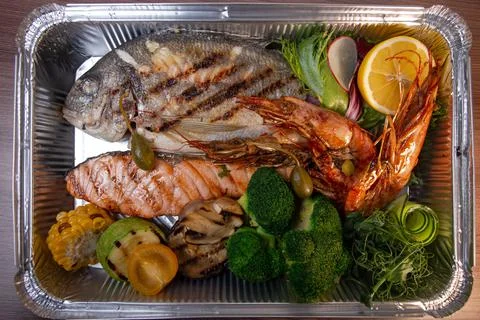 Top view fish set with shrimp and broccoli Stock Photos