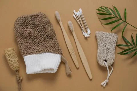 Top view flat lay bamboo toothbrush and cotton swabs, pumice, jute washcloth  Stock Photos