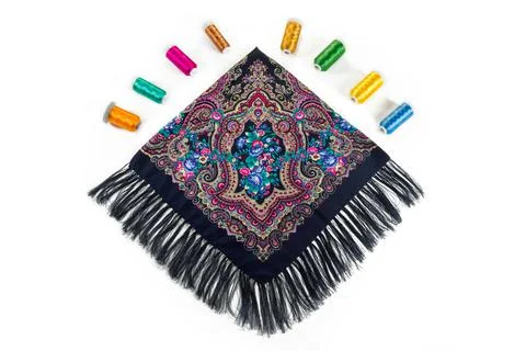 Top view flat lay on black cotton scarf with fringe and bright oriental ornam 写真素材
