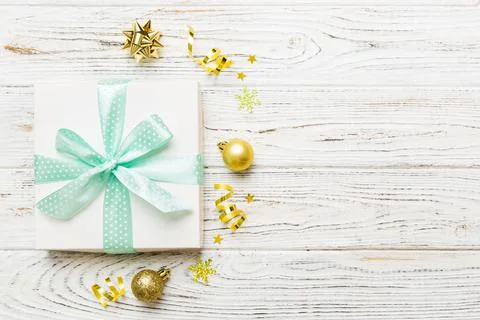 Top view Flat lay Christmas decorations and gift box on colored background wi Stock Photos