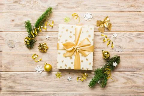 Top view Flat lay Christmas decorations and gift box on colored background wi Stock Photos