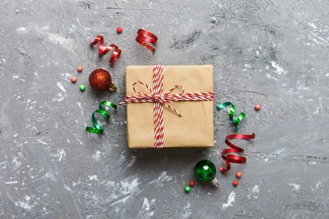 Top view Flat lay Christmas decorations and gift box on colored background wi Stock Photos