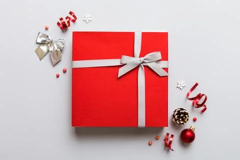 Top view Flat lay Christmas decorations and gift box on colored background .. Stock Photos