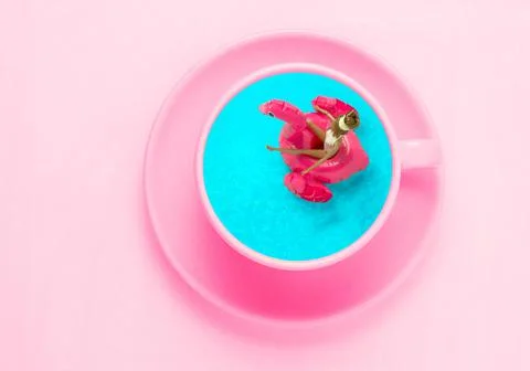 Top view flat lay coffee  pink cup on with swimming pool in it. Creative art  Stock Photos