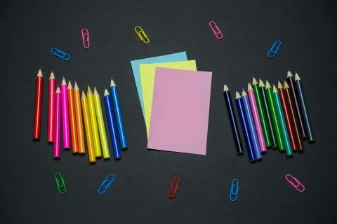 Top view flat lay colored pencils, blank colored sheets of paper  and colored Stock Photos