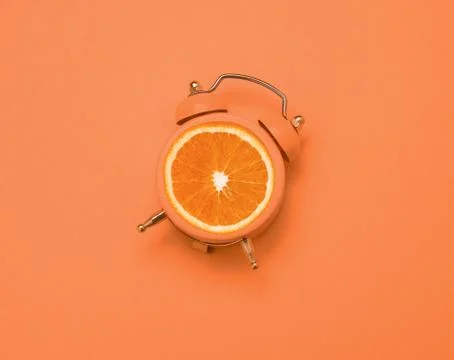 Top view flat lay creative art collage alarm clock and orange copy space Stock Photos