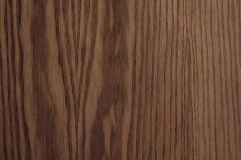 Top view flat lay of dark brown walnut wooden panel texture surface with ve.. Stock Photos